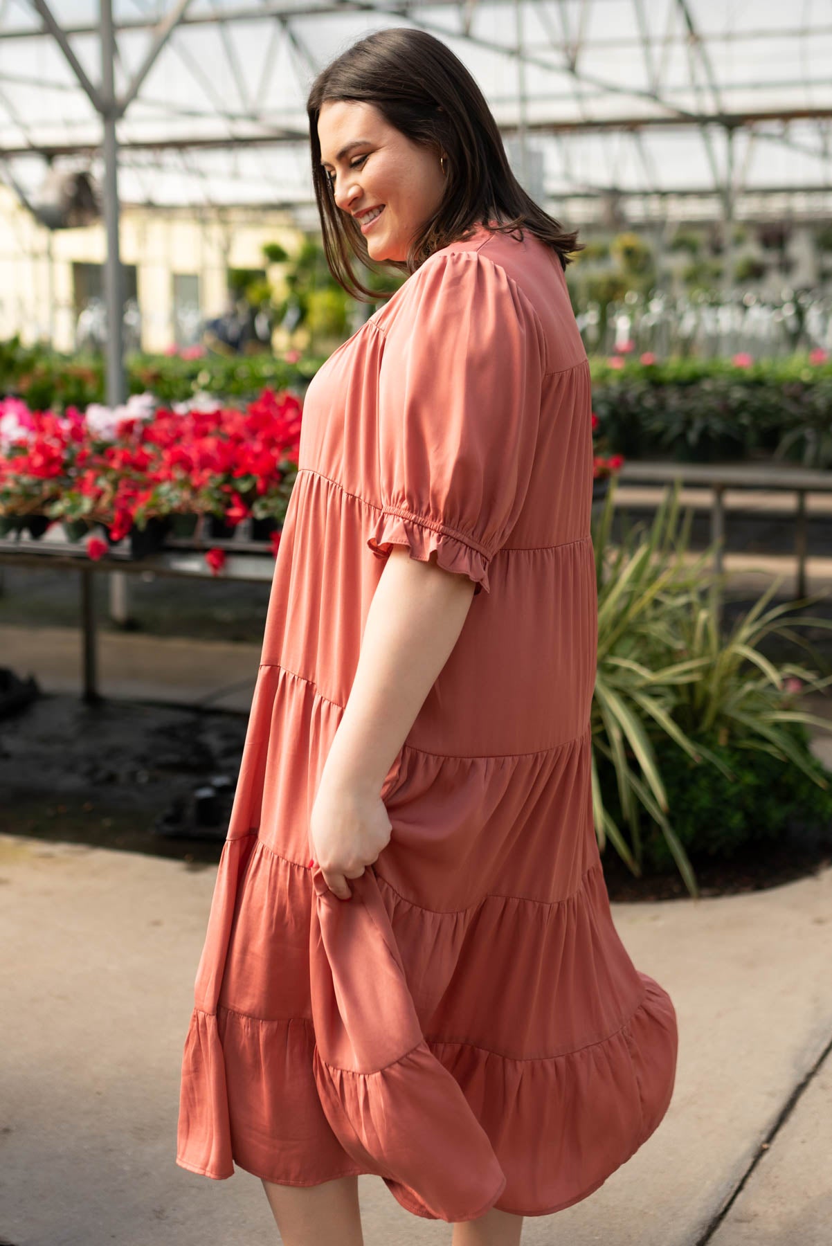 Side view of the plus size clay satin tiered dress