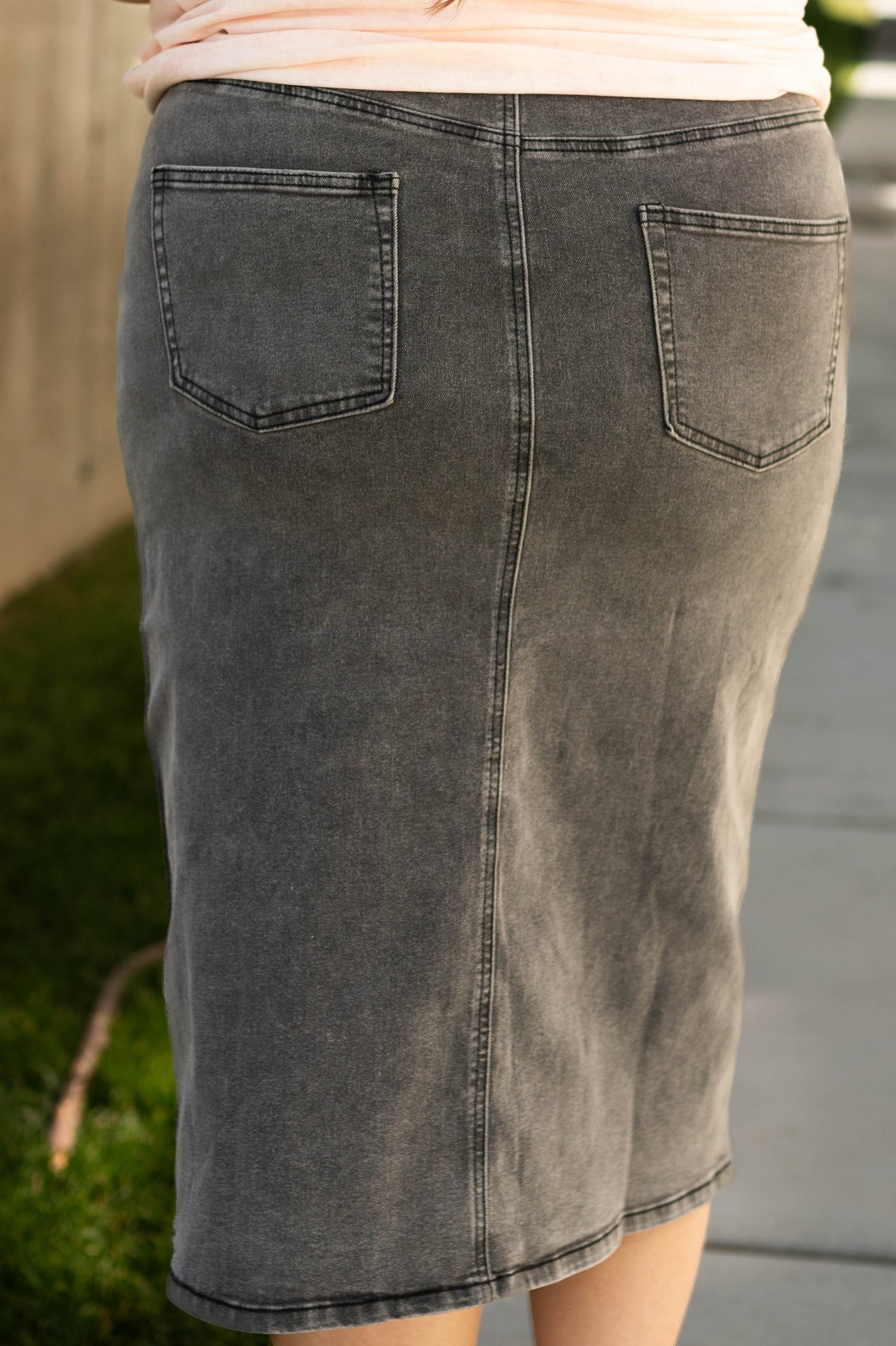 Back view of a plus size black skirt