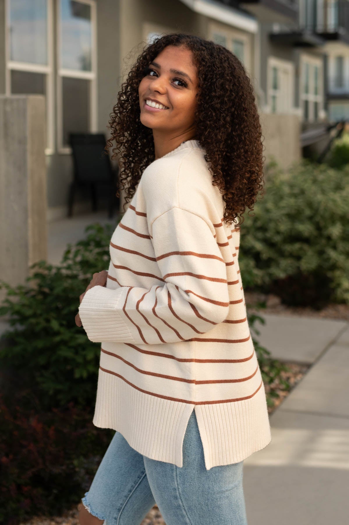 Side view of a ivory sweater