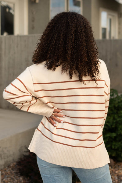 Back view of a ivory sweater