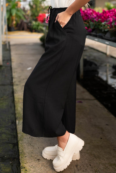 Side view of the black wide leg pants