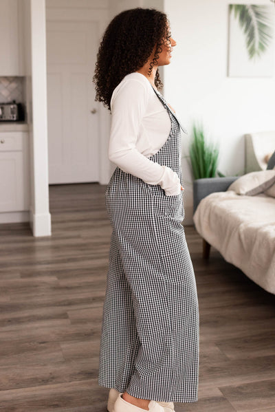 Side view of the black gingham overalls