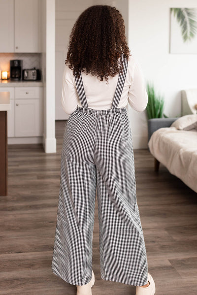 Back view of the black gingham overalls