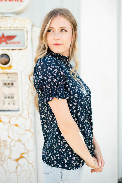 Side view of a navy floral top