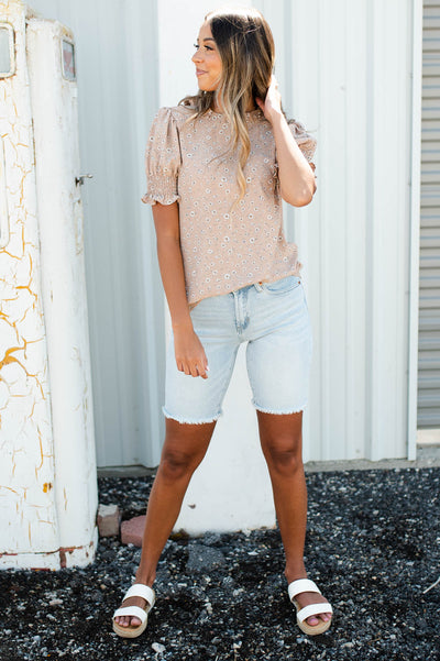 Short sleeve taupe floral top with a ruffle neck
