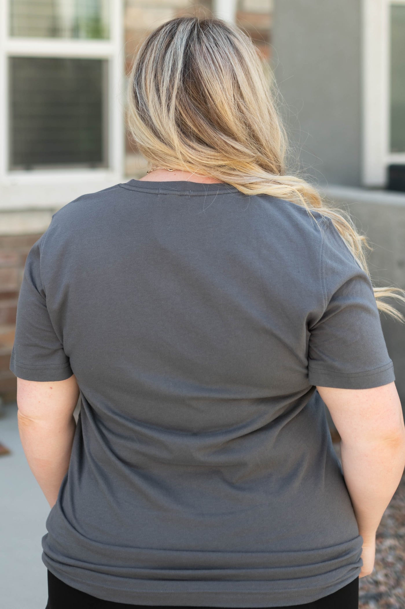 Back view of a plus size giddy up charcoal top