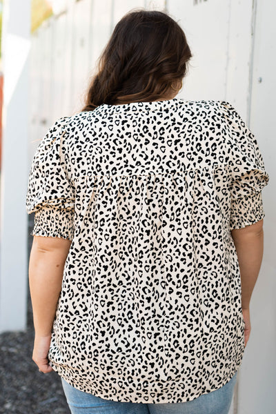 Back view of a Plus size cream leopard top