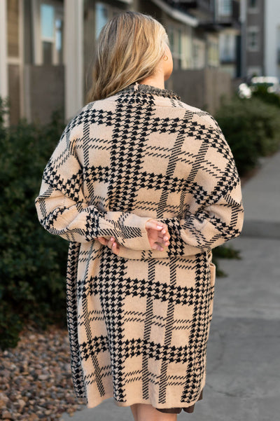 Back view of a taupe cardigan