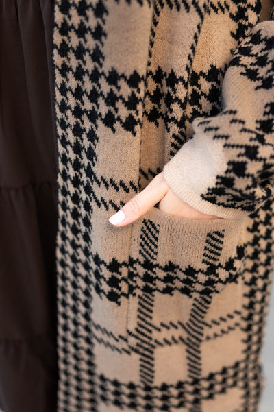 Pattern on a taupe cardigan