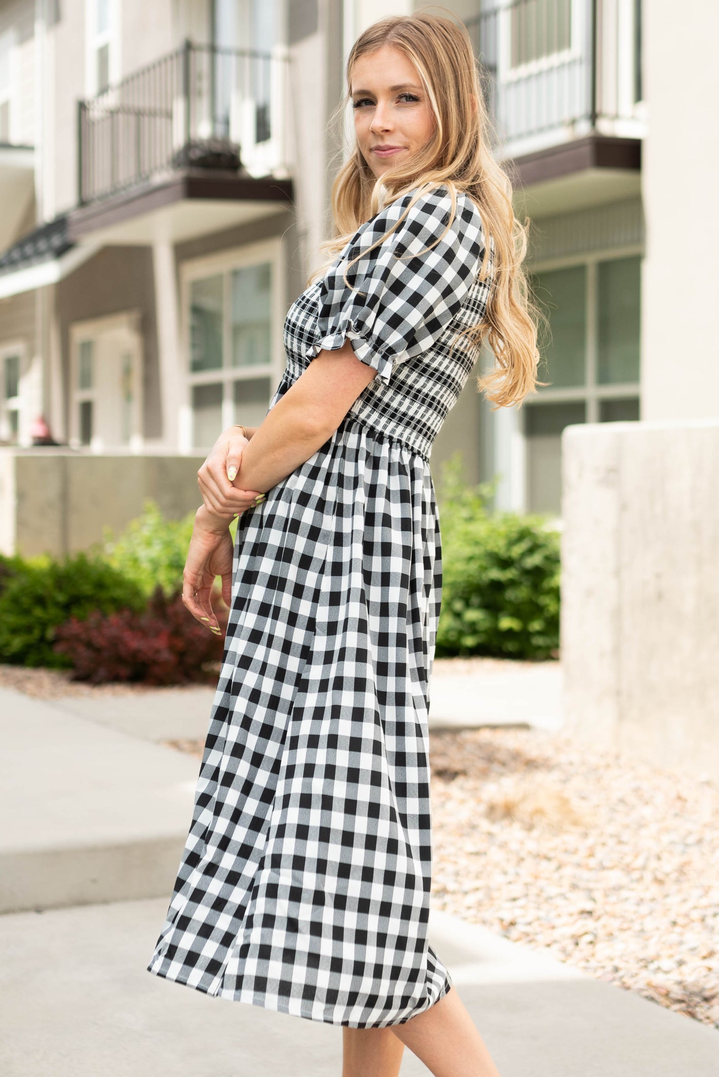 Side view of a black gingham dress