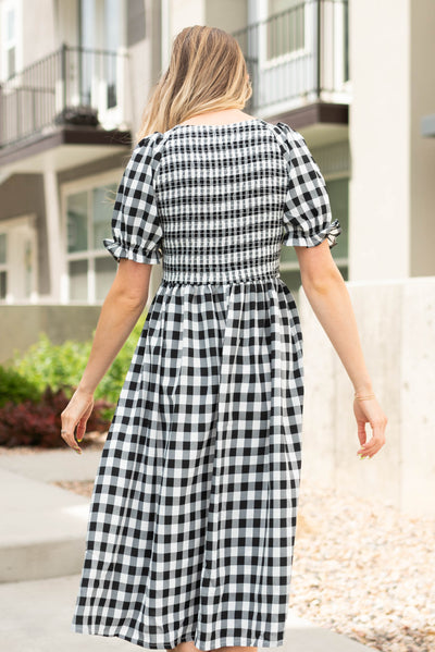 Back view of a black gingham dress