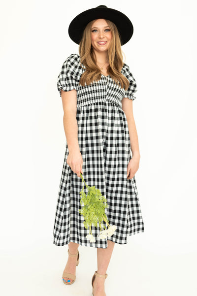 Midi black gingham dress with short sleeves and smocked bodice