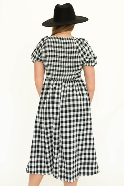 Back view of a black gingham dress