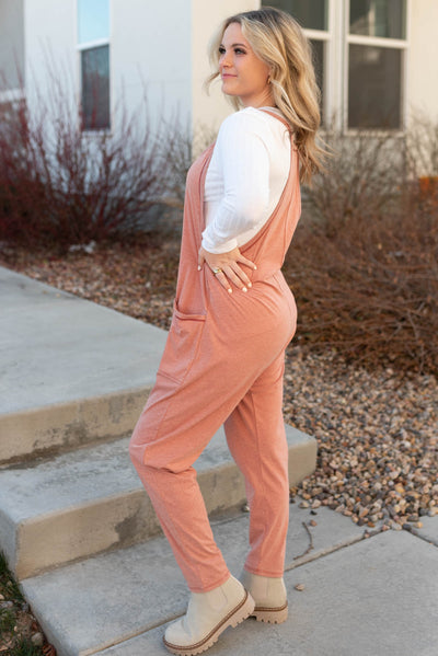 Side view of a terracotta jumpsuit