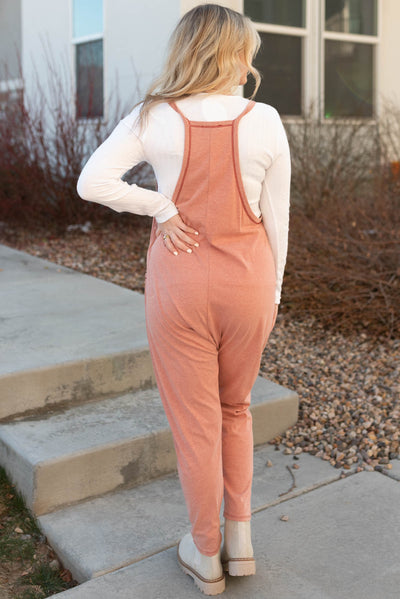 Back view of a terracotta jumpsuit