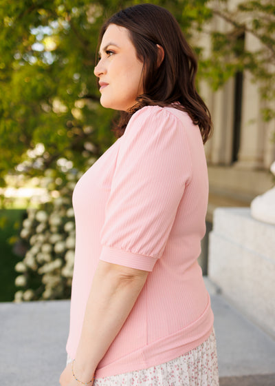 Side view of the plus size basic pink top
