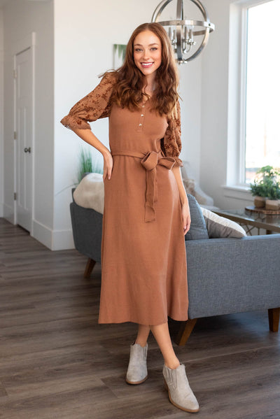 Brown dress with buttons at the neck