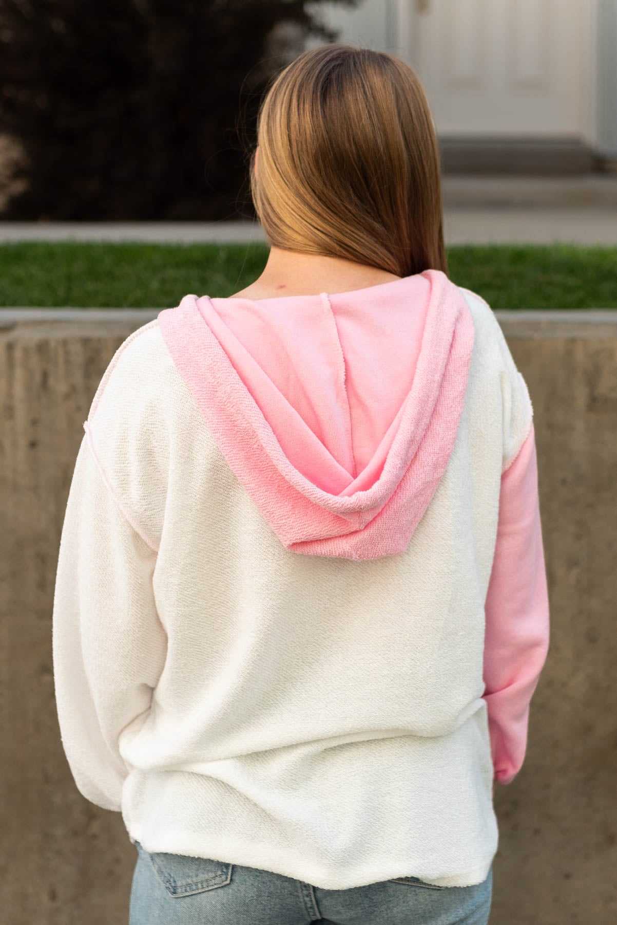 Back view of a pink hoodie