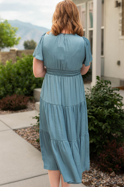 Back view of a light teal dress