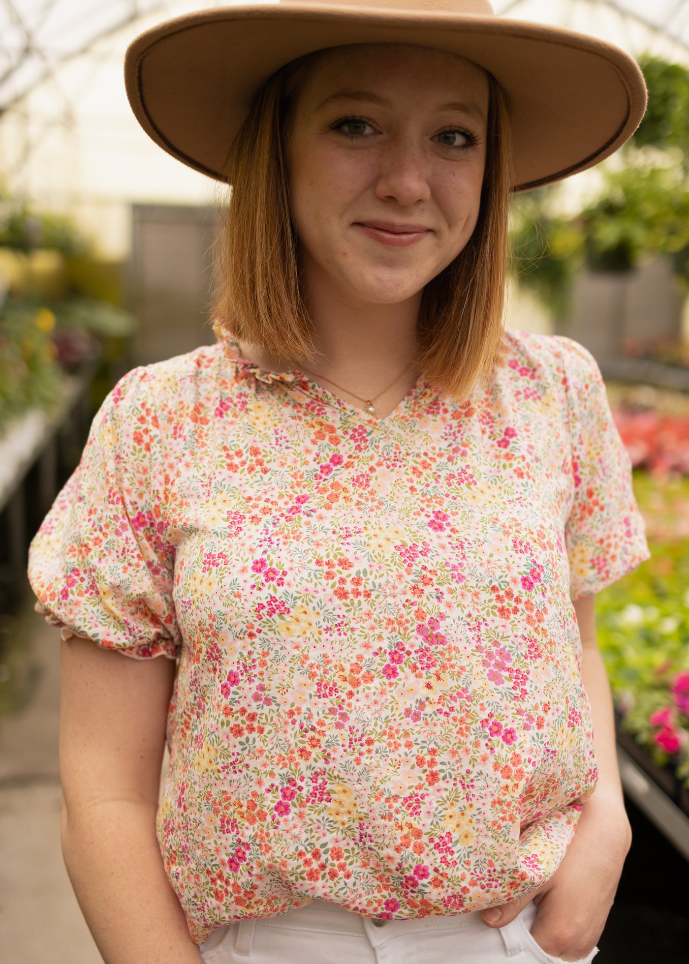 Medium pink floral top with short sleeves with a ruffle cuff