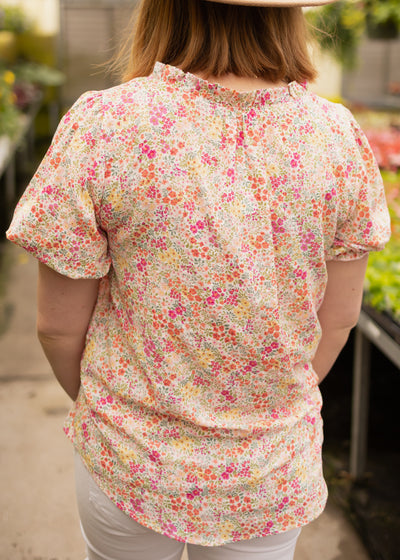 Back view of a pink floral top