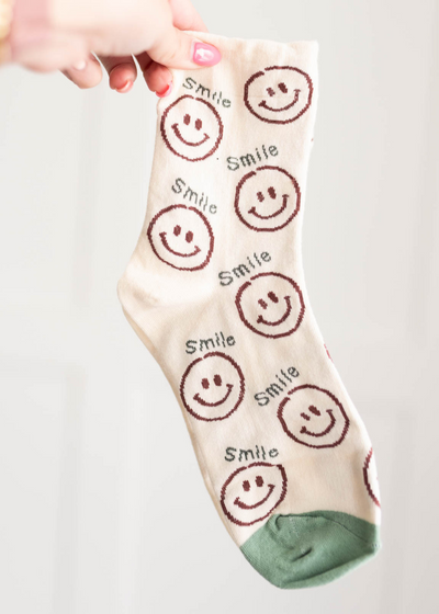 Cream smile socks with a sage toe