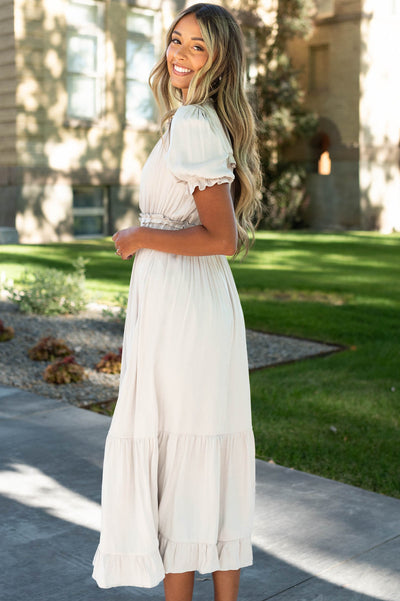 Side view of a short sleeve ivory dress