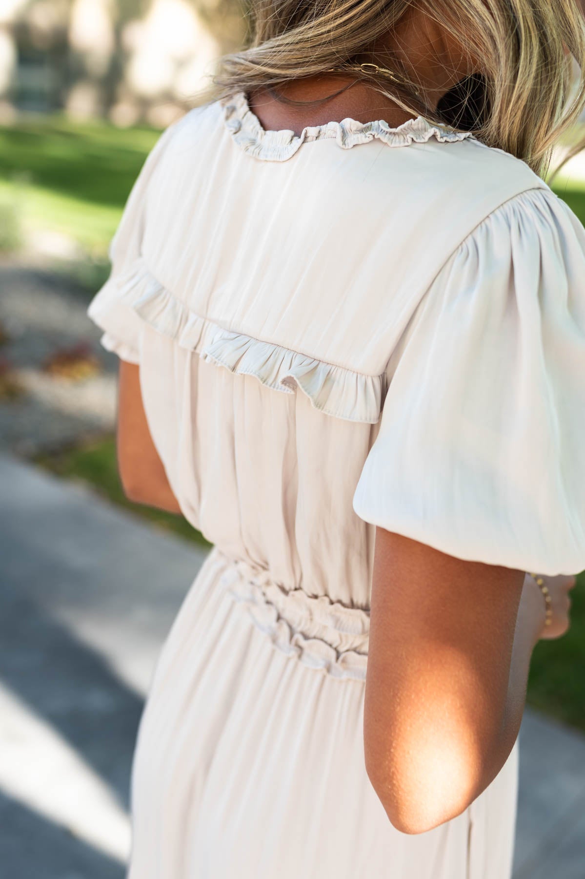 Close up of the back of an ivory dress