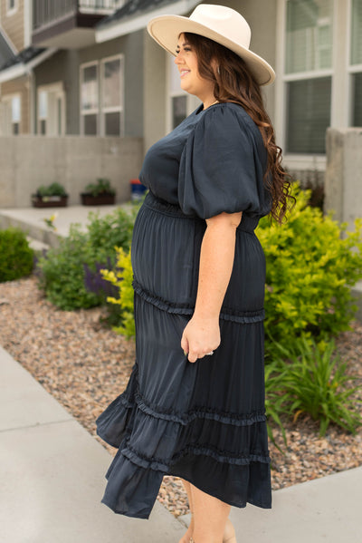 Side view of a plus size short sleeve deep navy dress
