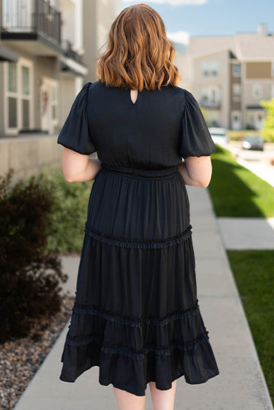 Back view of a deep navy dress