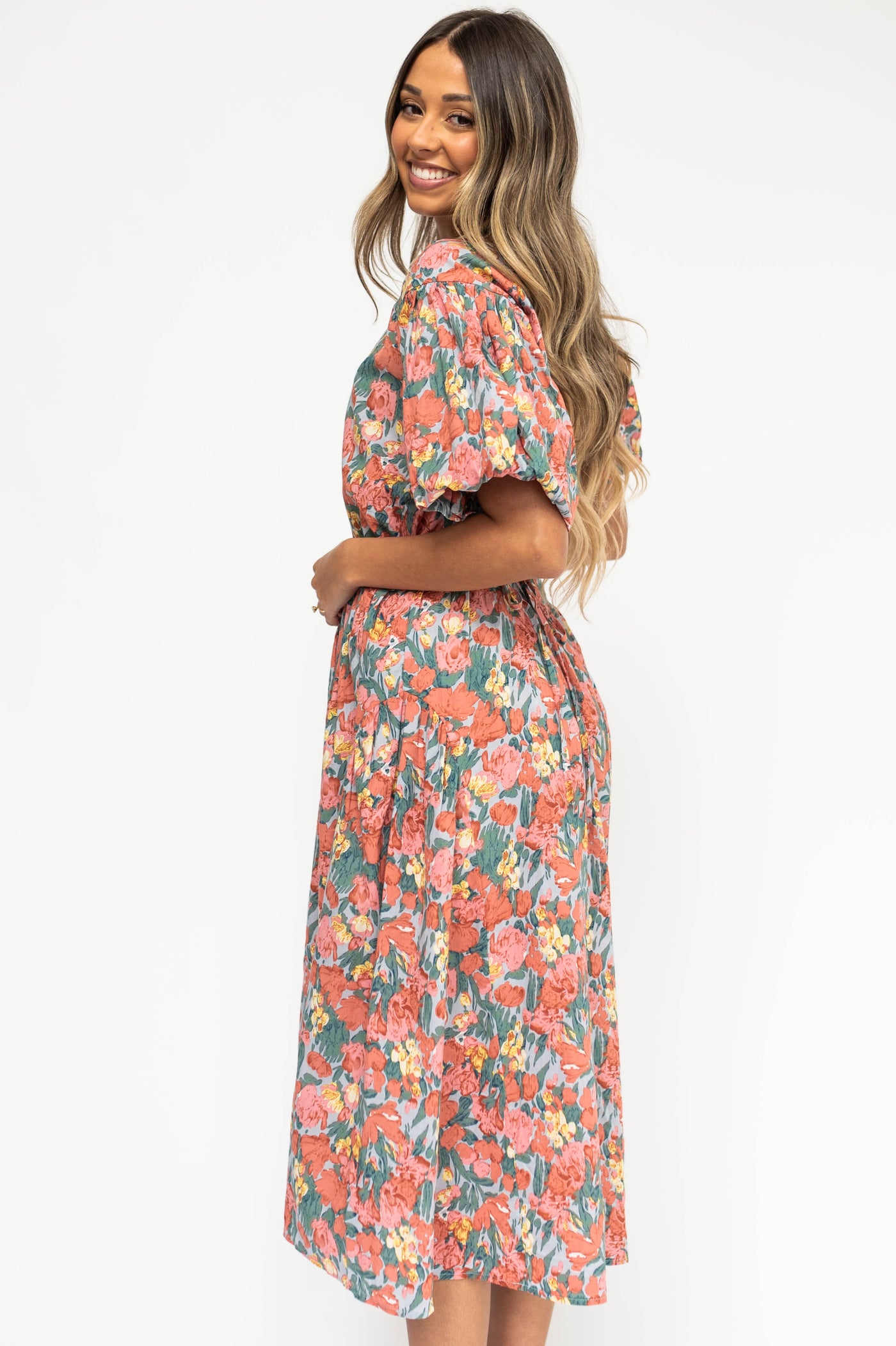 Side view of a coral floral dress