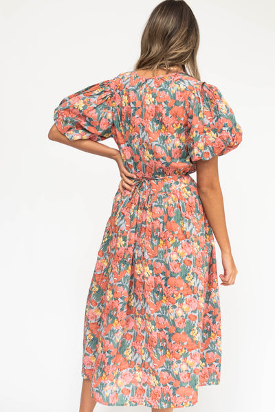 Back view of a coral floral dress