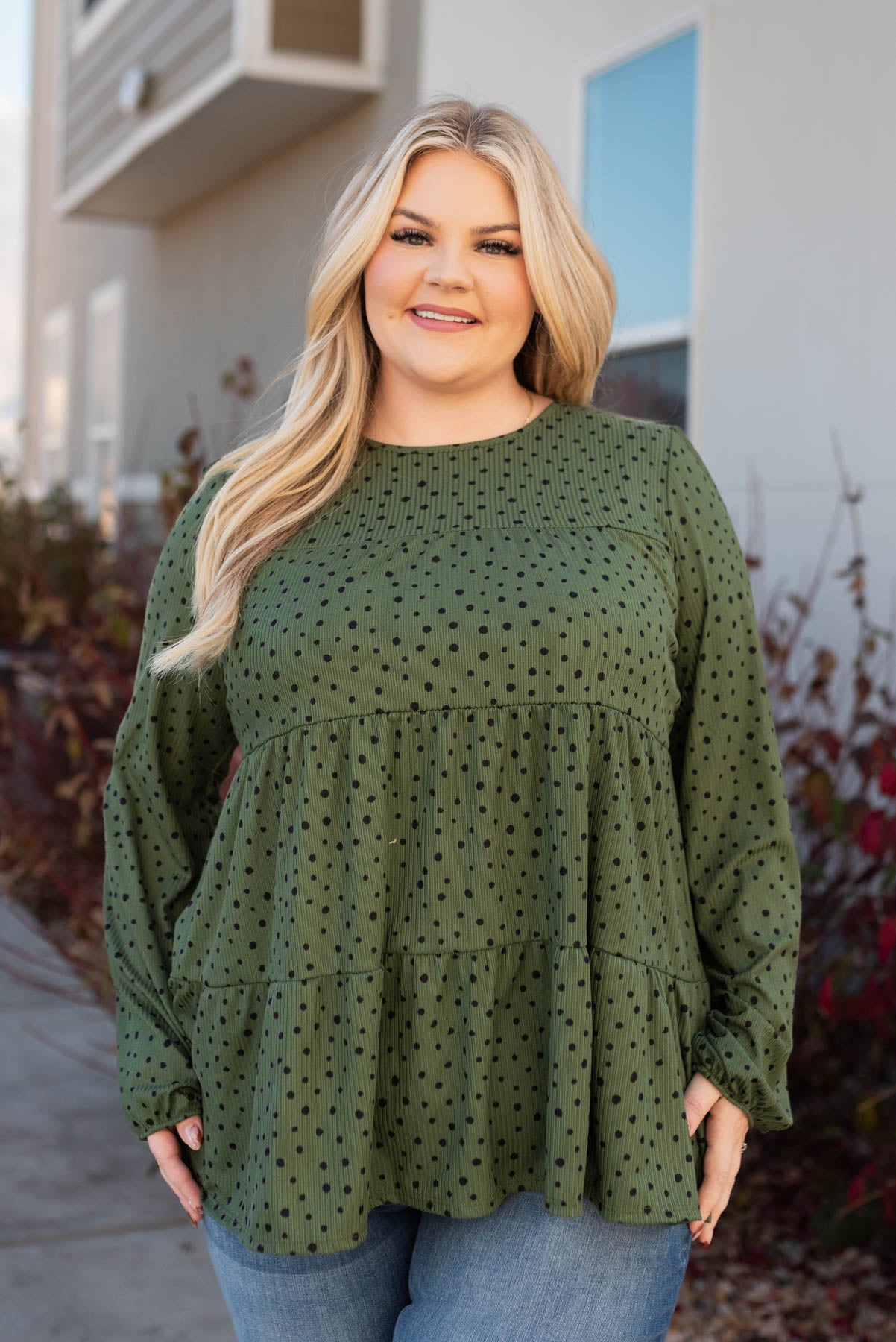 Front view of the plus size olive tiered top