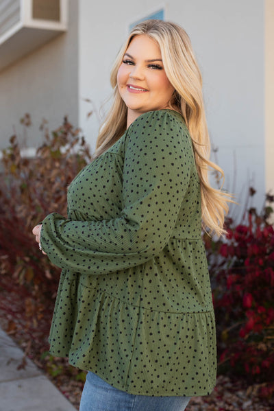 Side view of the plus size olive tiered top