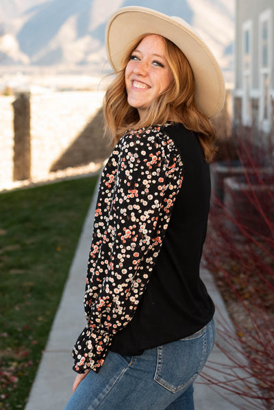 Side view of the black pattern sleeve top