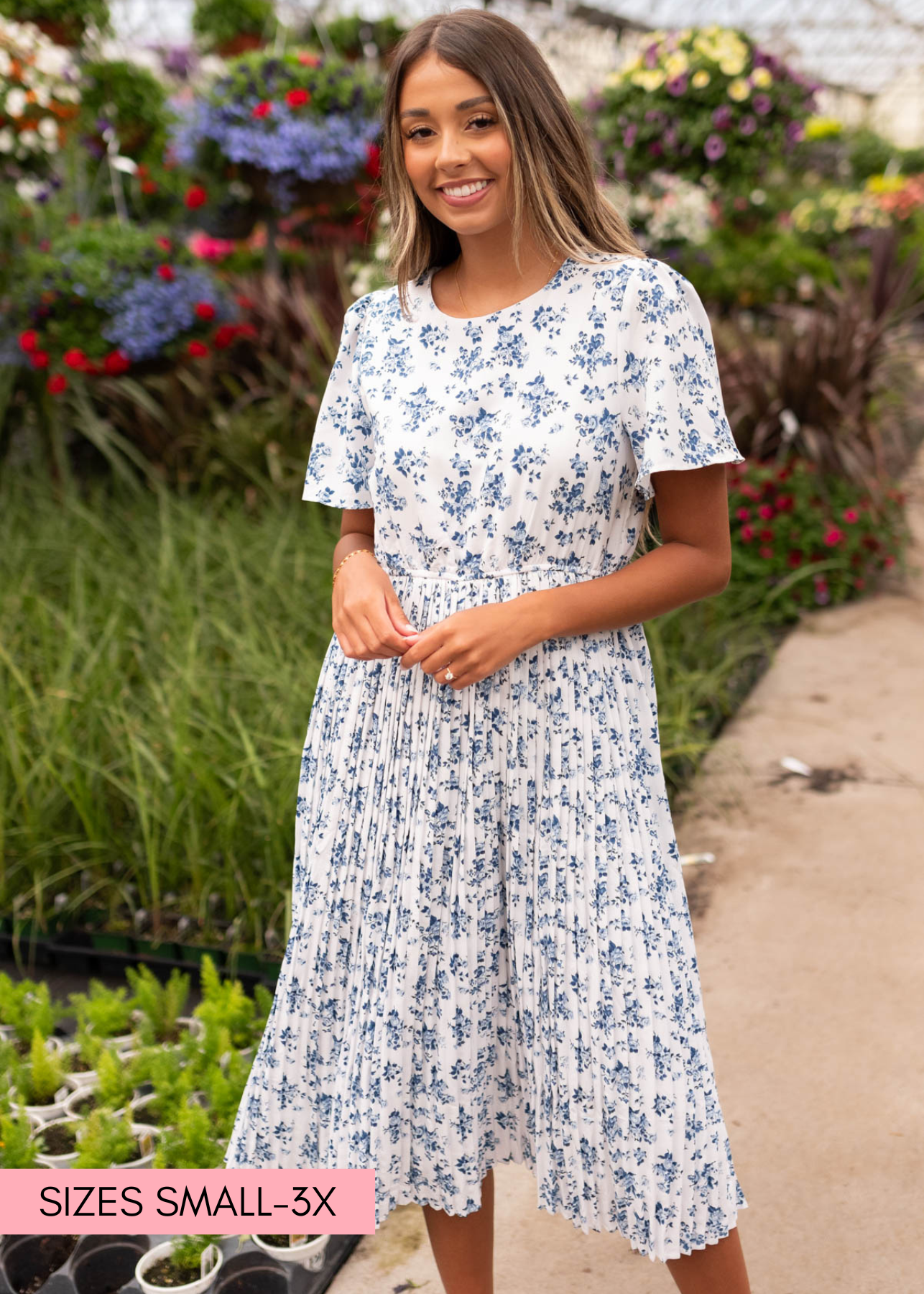 Front view of the blue floral pleated dress