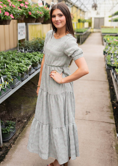 Side view of the pink and green gingham dress