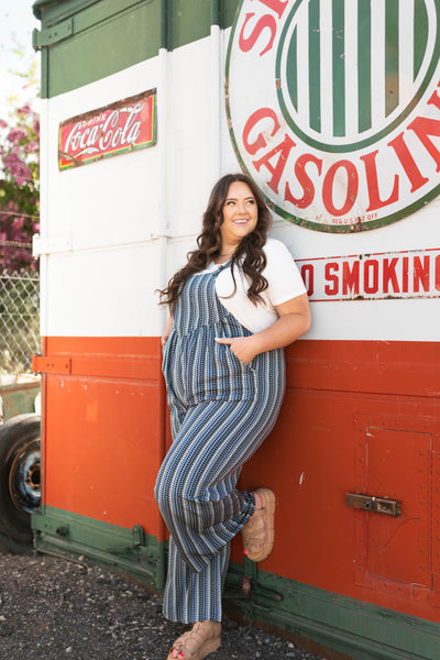 Side view of plus size midnight blue jumpsuit