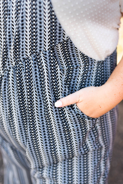 Midnight blue jumpsuit with pocket and fabric pattern