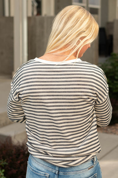 Back view of a navy striped top