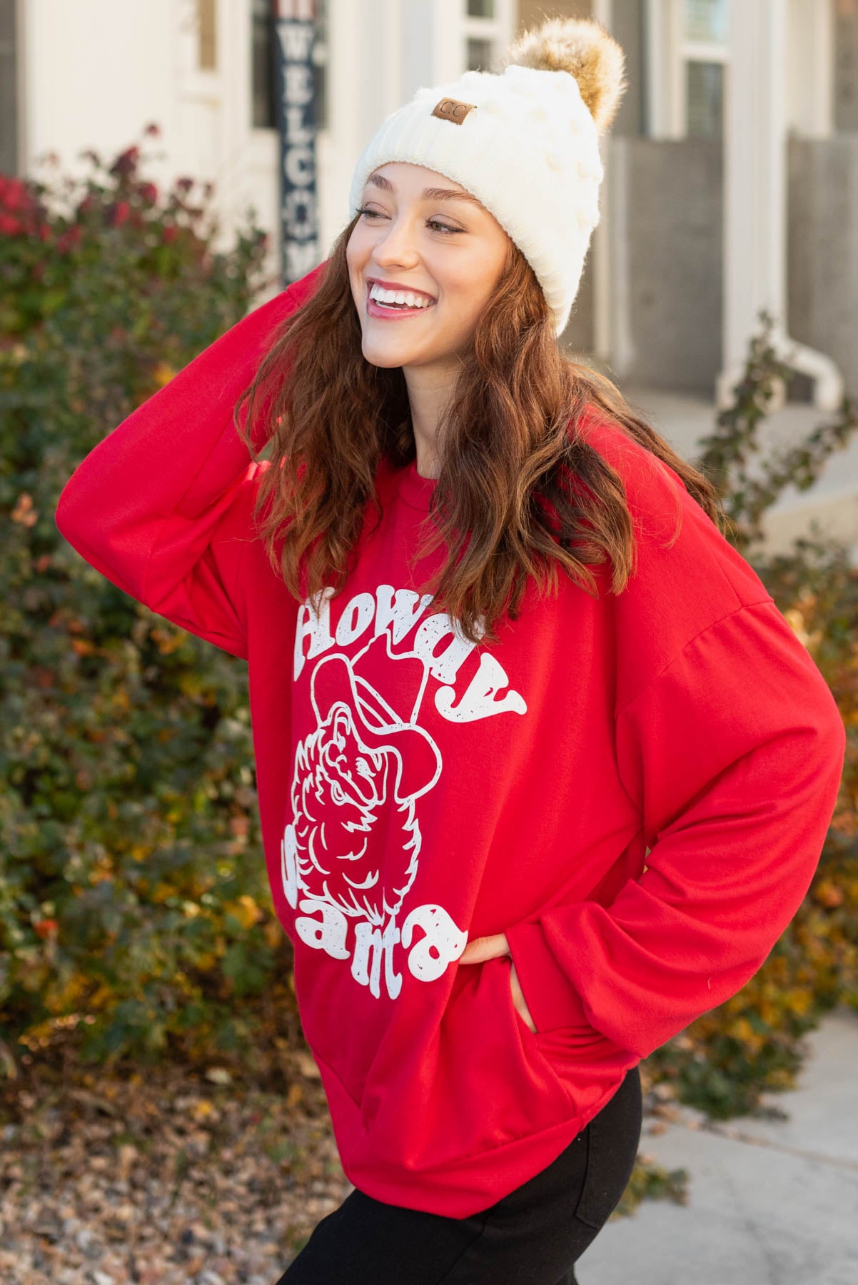 Side view of the howdy santa sweater with pockets
