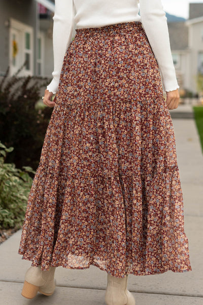 Back view of a burgundy floral skirt