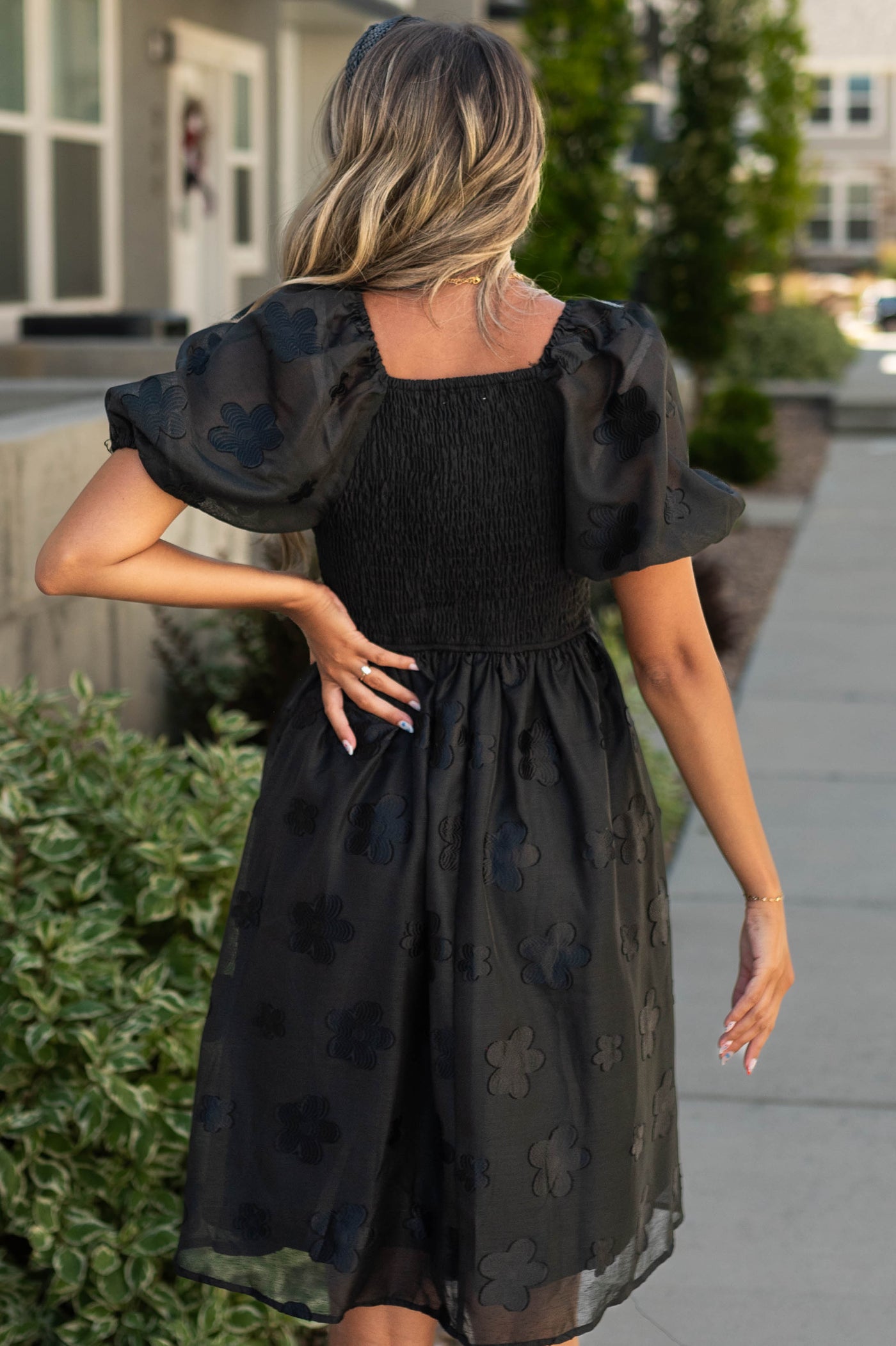 Back view of a black floral dress
