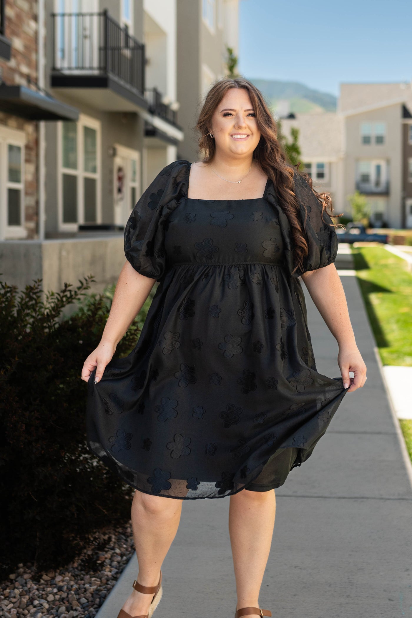 Plus size black floral dress with short sleeves and square neck