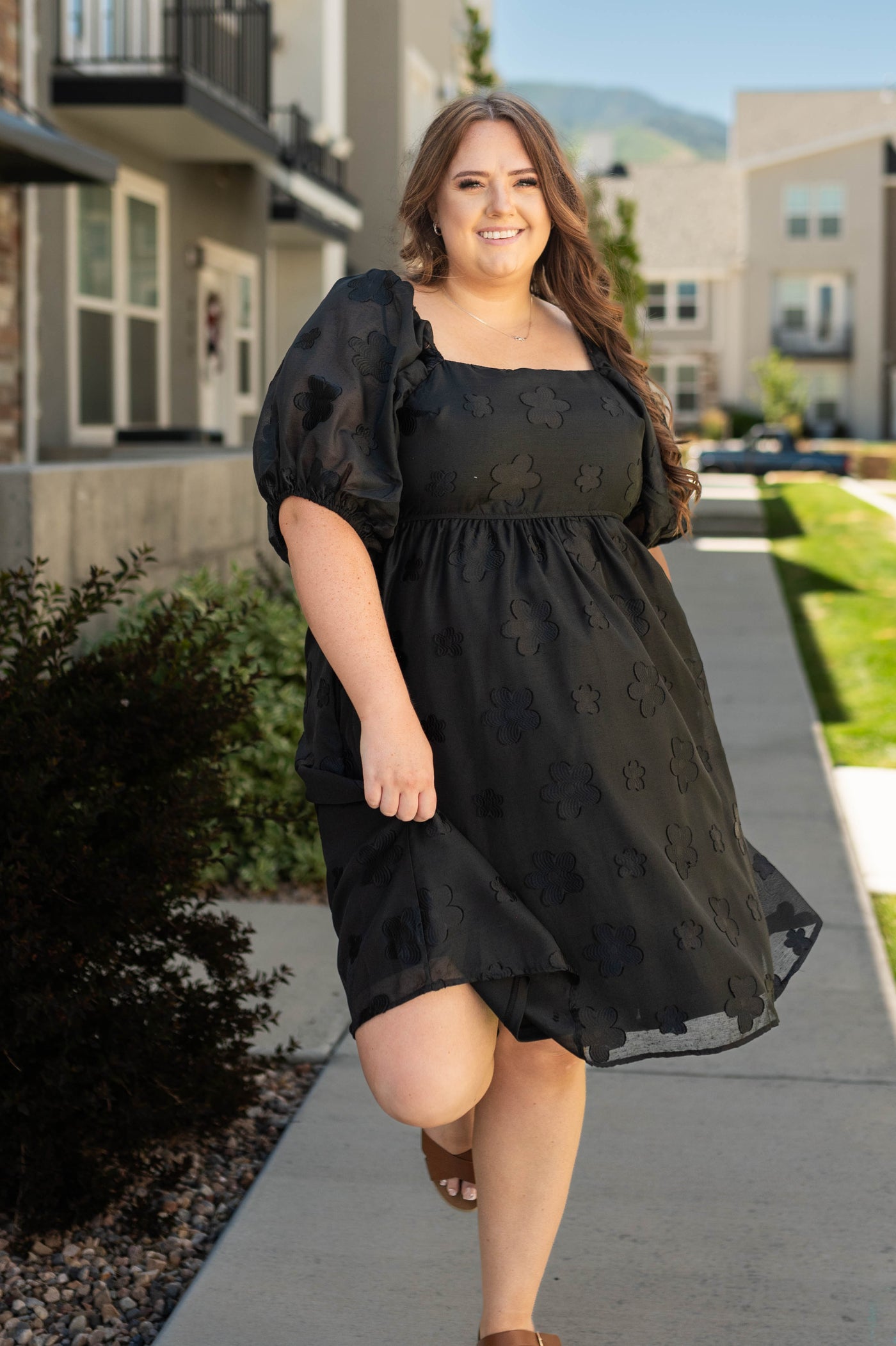 Plus size full short sleeve black floral dress with a square neck
