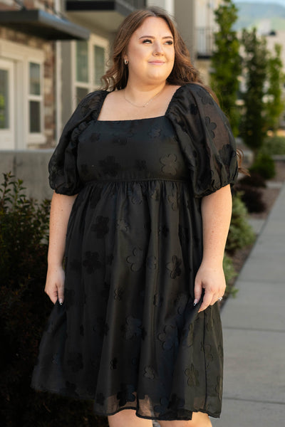 Plus size black floral dress with short sleeve and a square neck