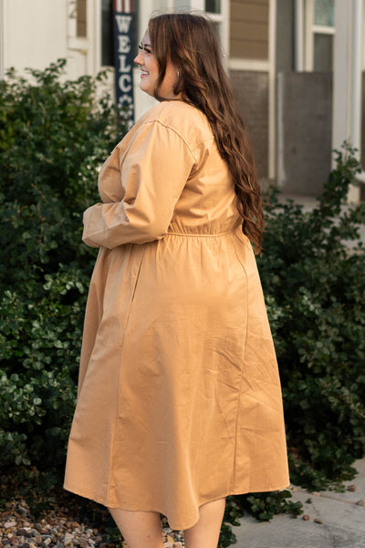 Side view of a plus size camel dress