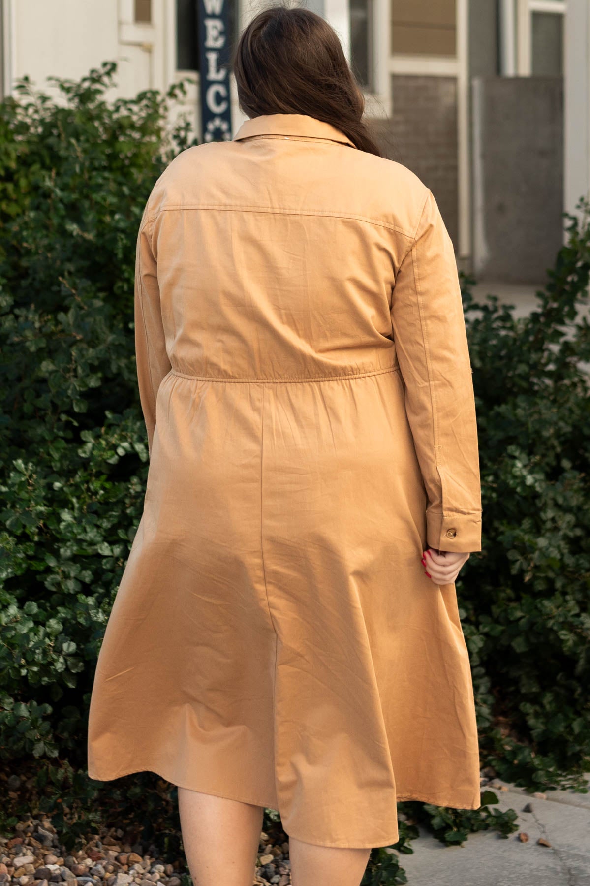 Back view of a plus size camel dress