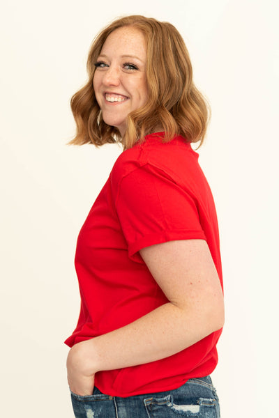 Side view of a red short sleeve top