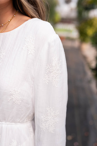 Close up of the fabric on the embroidered white dress